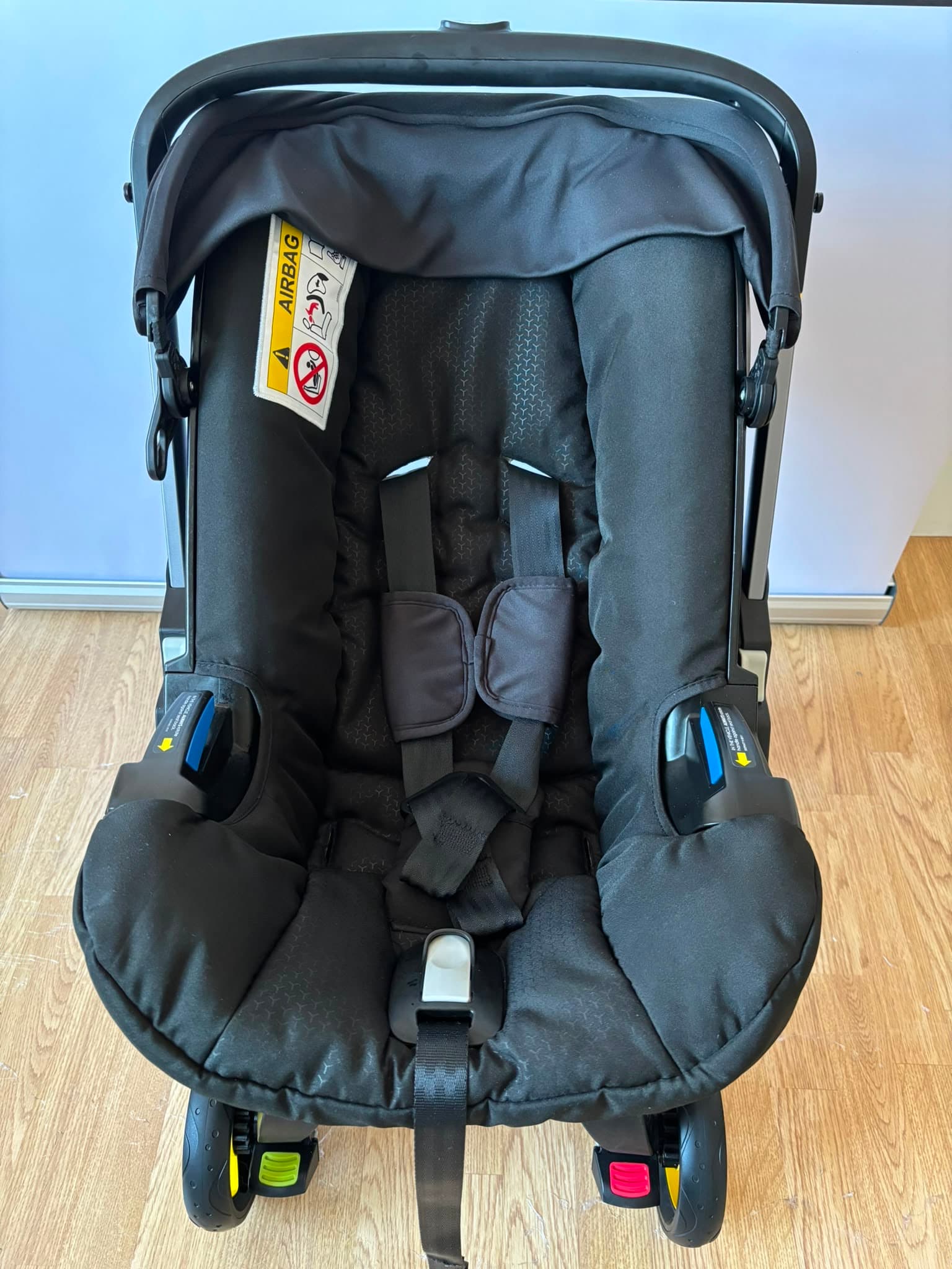 After cleaning, the Doona pram seat and frame looking clean and restored.