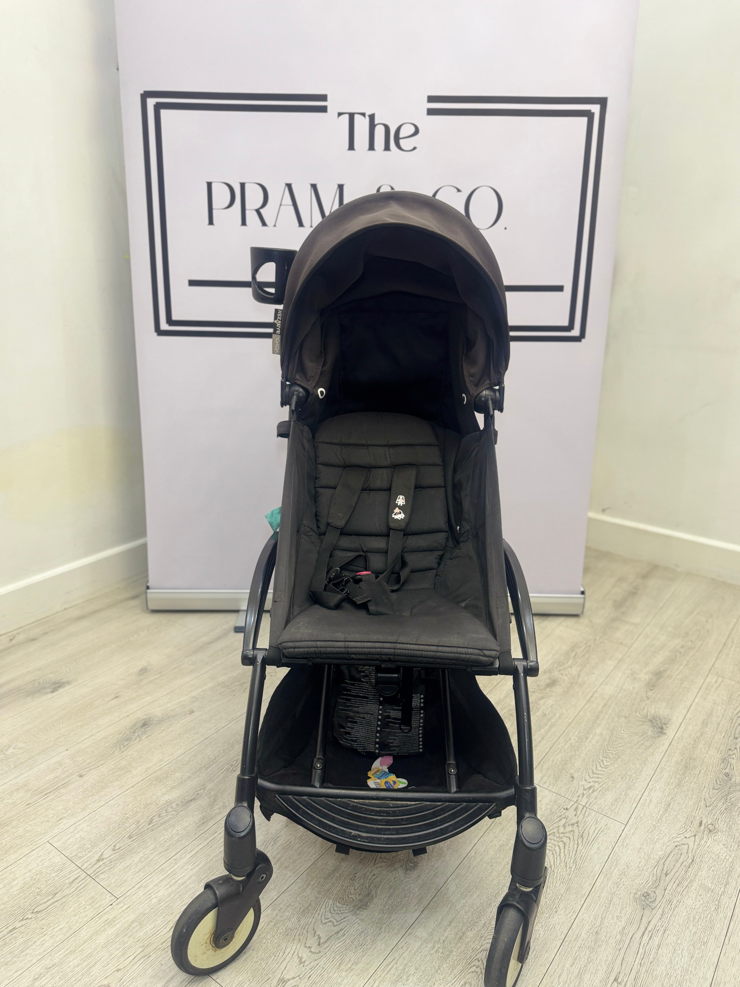 Before cleaning, a Yoyo pram with marked seat fabric and frame.